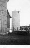 A view of the old wood stave silo and the new conc
